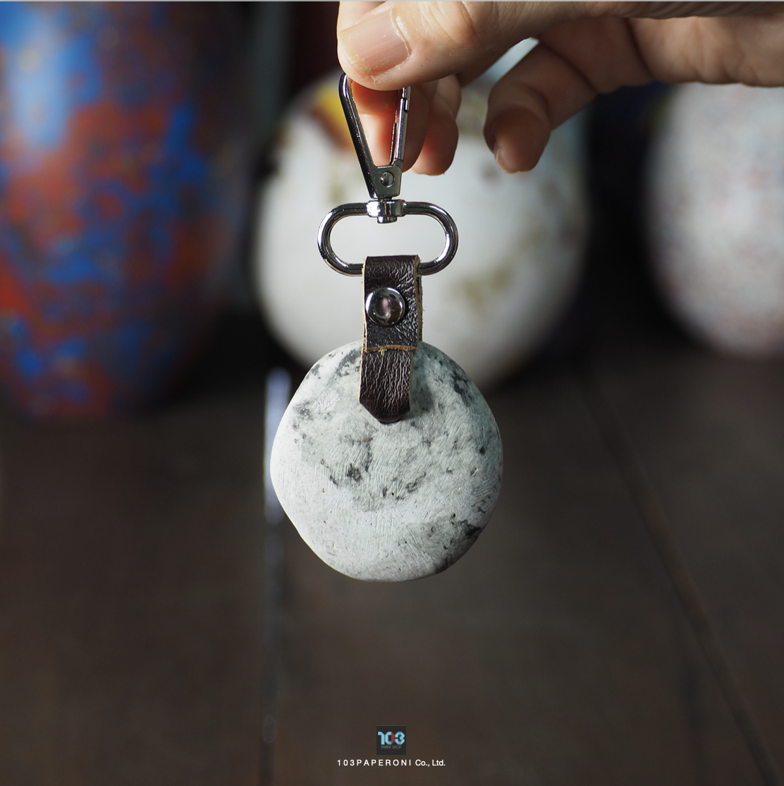 PAPER KEY CHAIN  :   Our designs give new life to recycled paper and other natural materials,  Handmade sculptures , Which is created piece by piece.