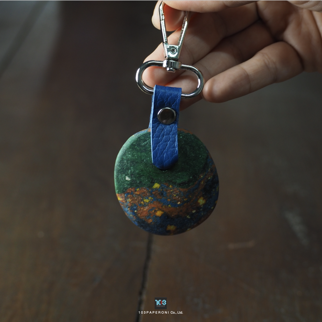 PAPER KEY CHAIN  :   Our designs give new life to recycled paper and other natural materials,  Handmade sculptures , Which is created piece by piece.